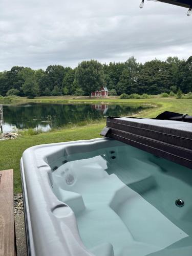 Fennville House | 11 Acre Wood - Cabin getaway - fishing & swimming pond - hot tub