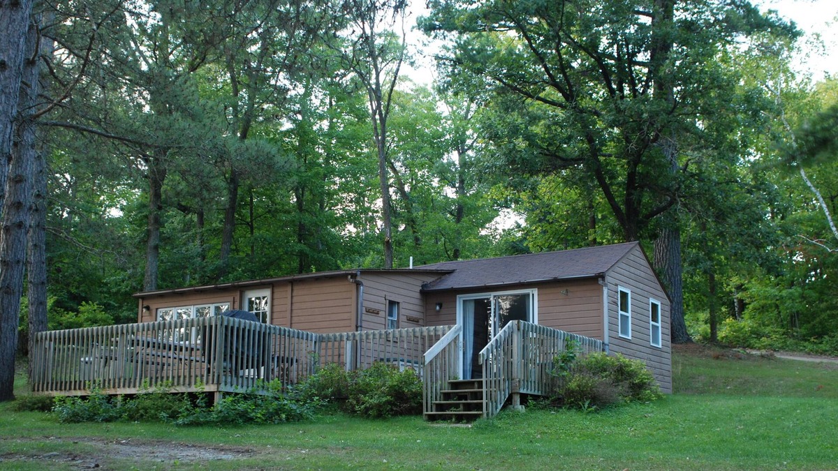 Nevis Cabin | 2BR Cabin Nestled in Towering Pines on a quiet lake. Pets accepted!