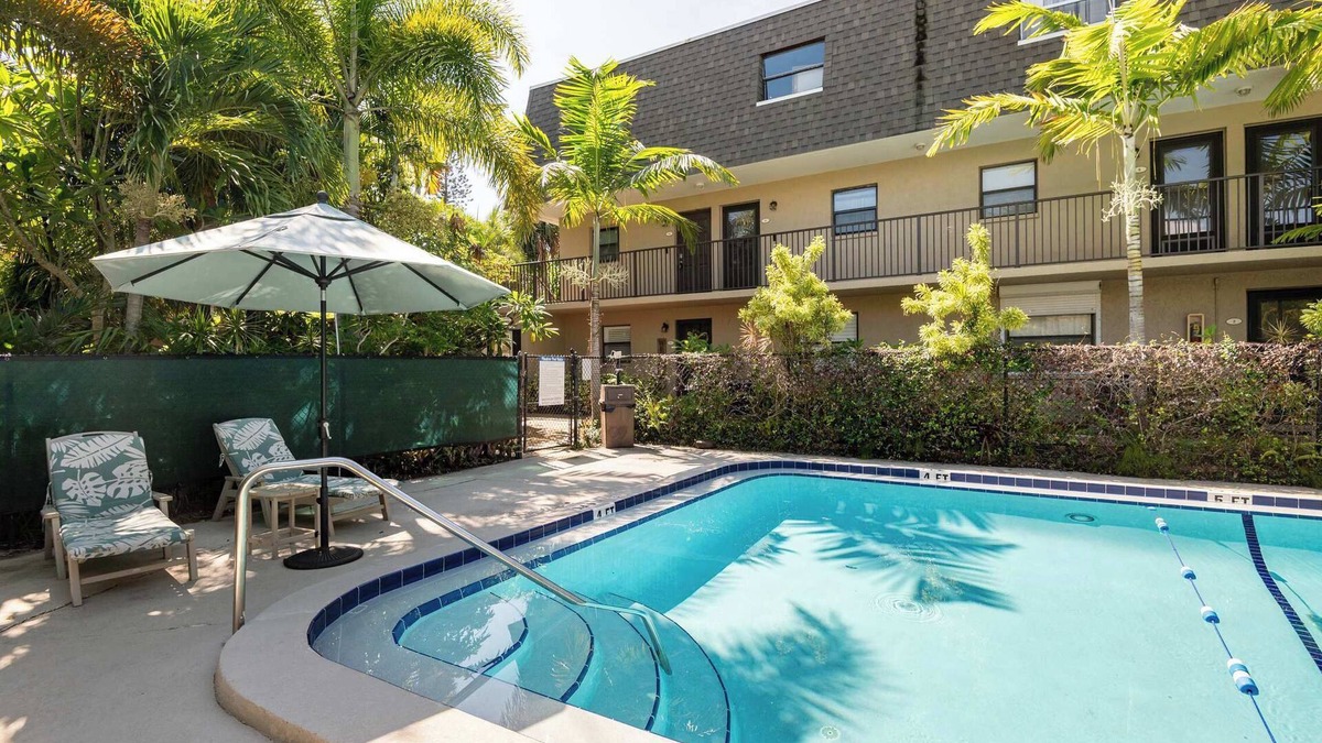 Indian Harbour Beach Condo | 2BR Stylish Retreat with BBQ, Pool & Beach