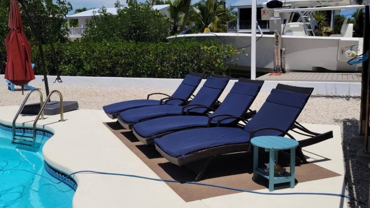 Breezeswept Beach Estates House | 3/2 two story home with pool and 80' dock on canal ocean side.
