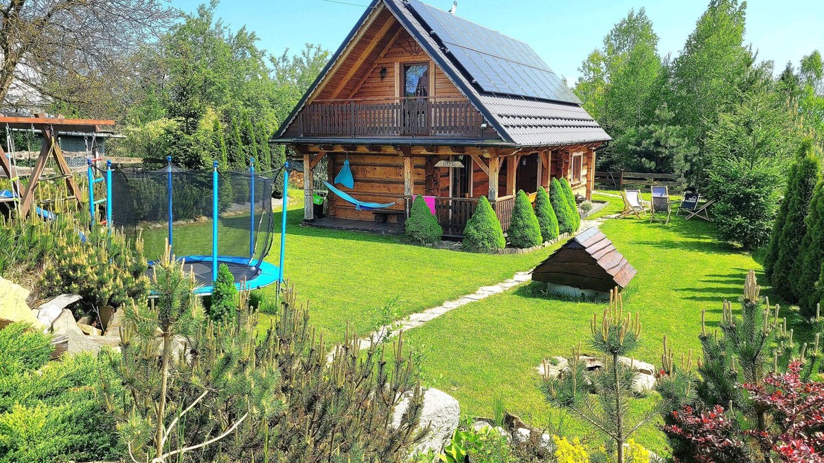 Raba Wyzna House | A beautiful wooden house with a sauna and jacuzzi and a large garden.