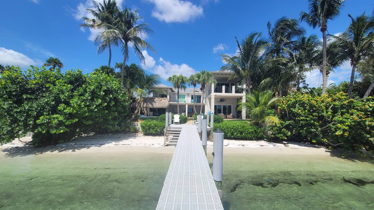 Boynton Beach Villa | A waterfront oasis with soft white sand beach, pool and intracoastal dock views.