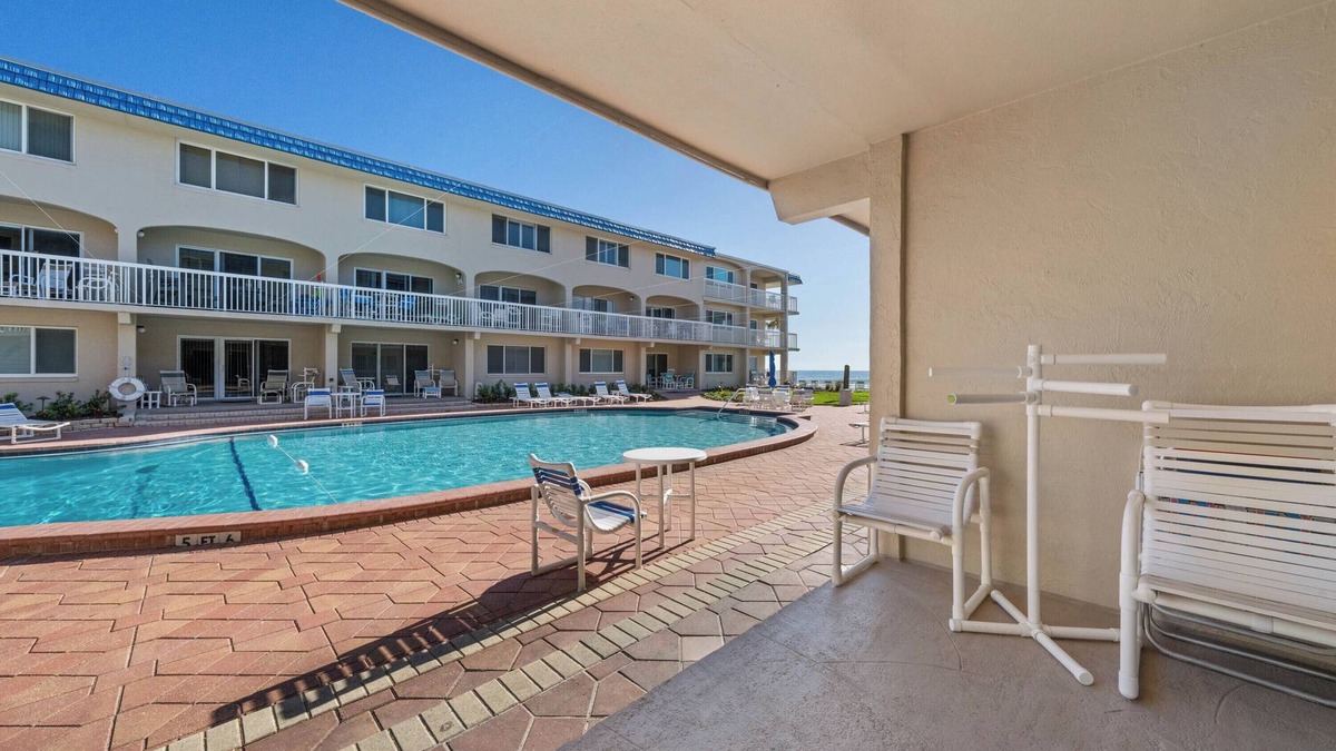 New Smyrna Beach Condo | A102 Fabulous location! Beachfront Condo with a pool view- Steps from coveted Flagler Ave