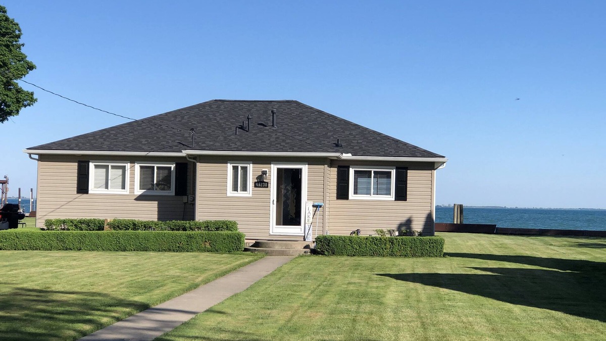 New Baltimore House | Adorable 4 bedroom lakefront home with dock on a quiet street