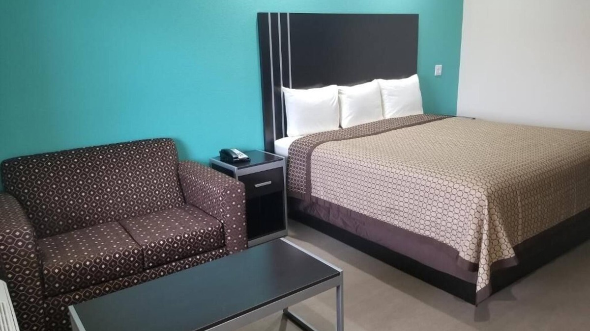 Bay City Hotel | Affordable Room w/Complimentary Breakfast, Microwave, and Full-Size Fridge