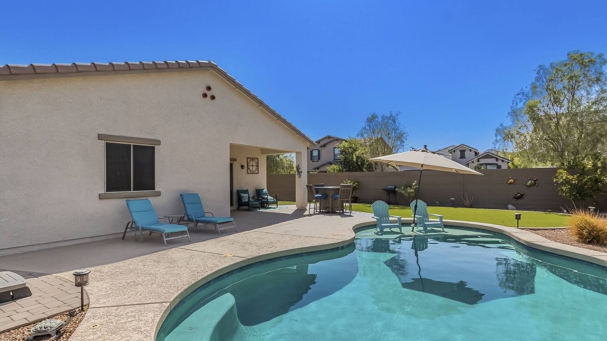 Buckeye House | Airy desert home with an enclosed yard, private pool, hot tub, firepit, & W/D