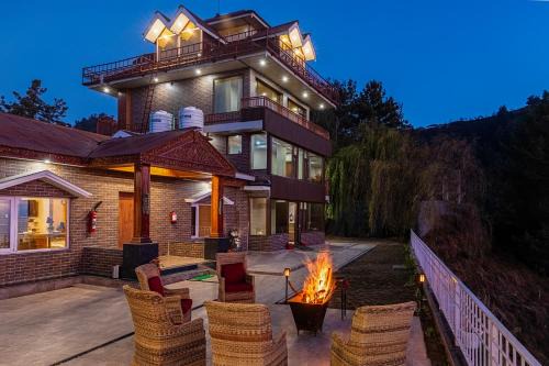 Theog House | Alaya Stays Lafu House Hearth Room with Cabana Hill views