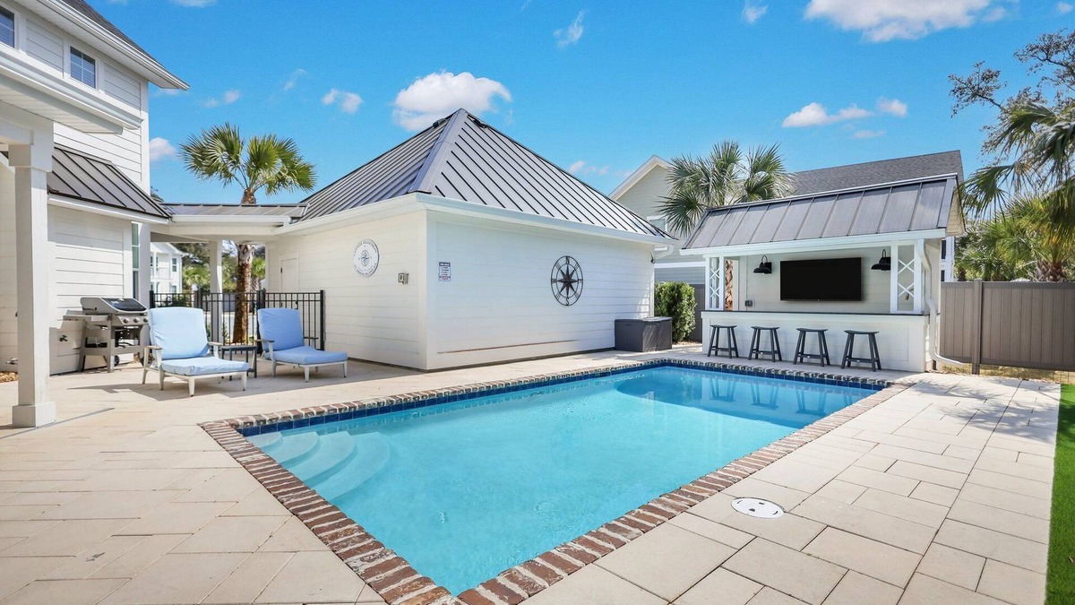 Saint Simons Island House | Amazing Island Oasis, Heated Pool, Outdoor Bar Area with TV, Bocce Ball Court & Putting Green