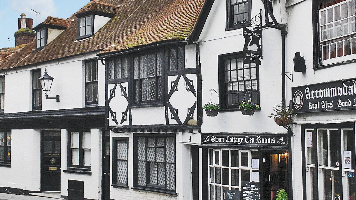 Rye Cottage | An unusual two-storey apartment with beams and an open fire.