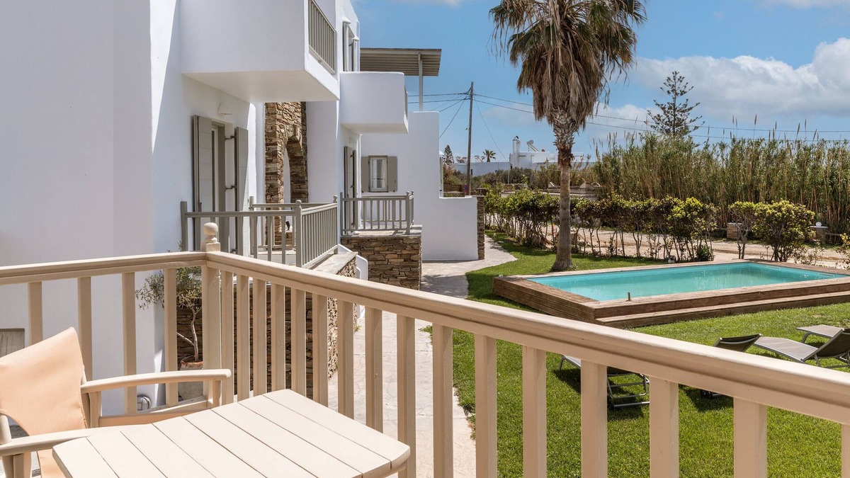 Kionia Apartment | Apartment In A Hotel 'Ninemia Suites Tinos Grand 105' with Shared Pool, Wi-Fi and Air Conditioning