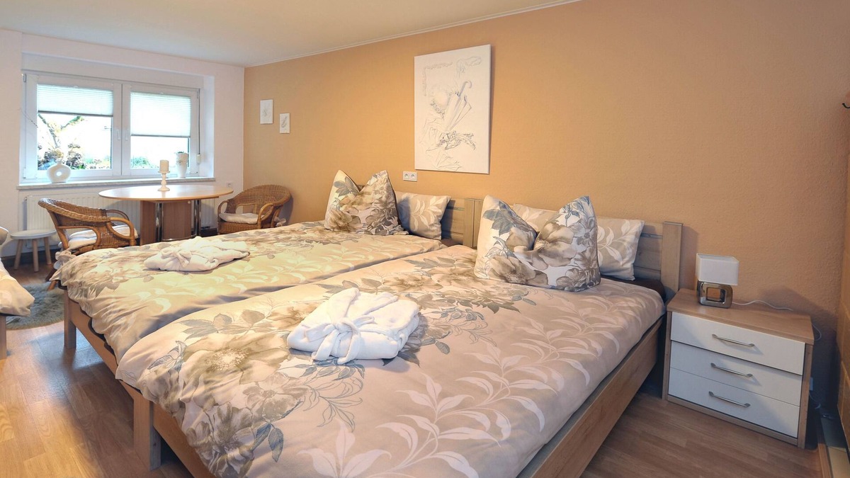 Babow Apartment | Apartment Rita 2, bedroom, living room, kitchen, shower/WC, outdoor seating area - Ferienwohnungen Rita