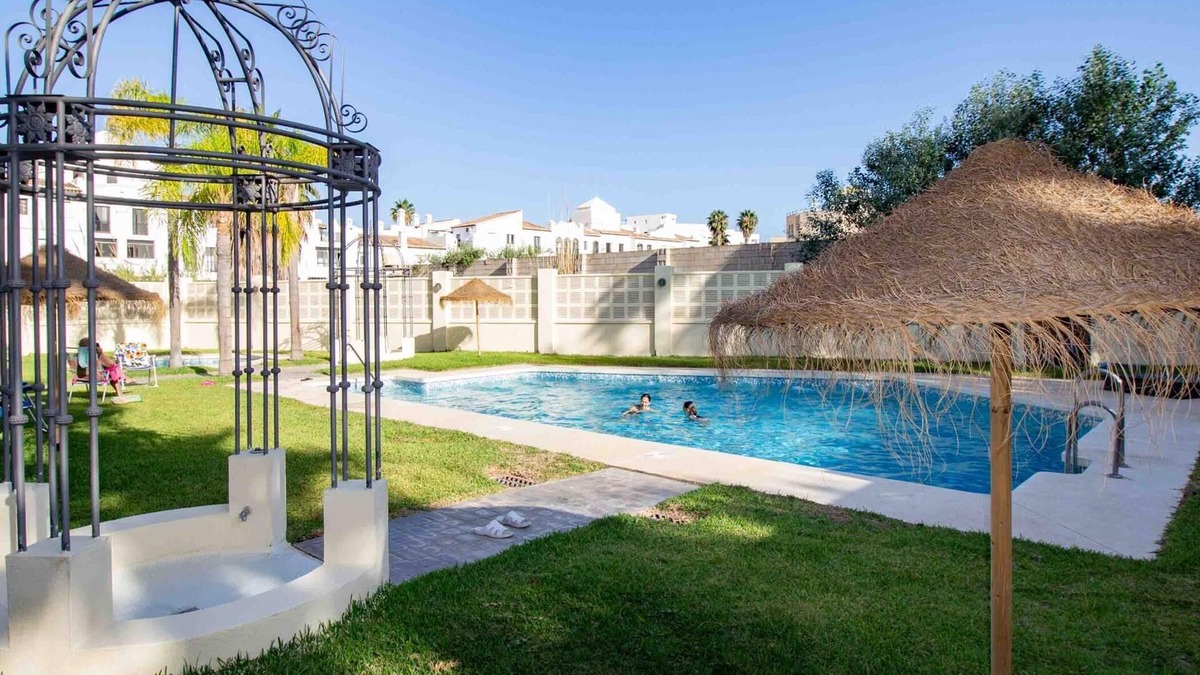 Playa Granada Apartment | Apartment with balcony and community pool