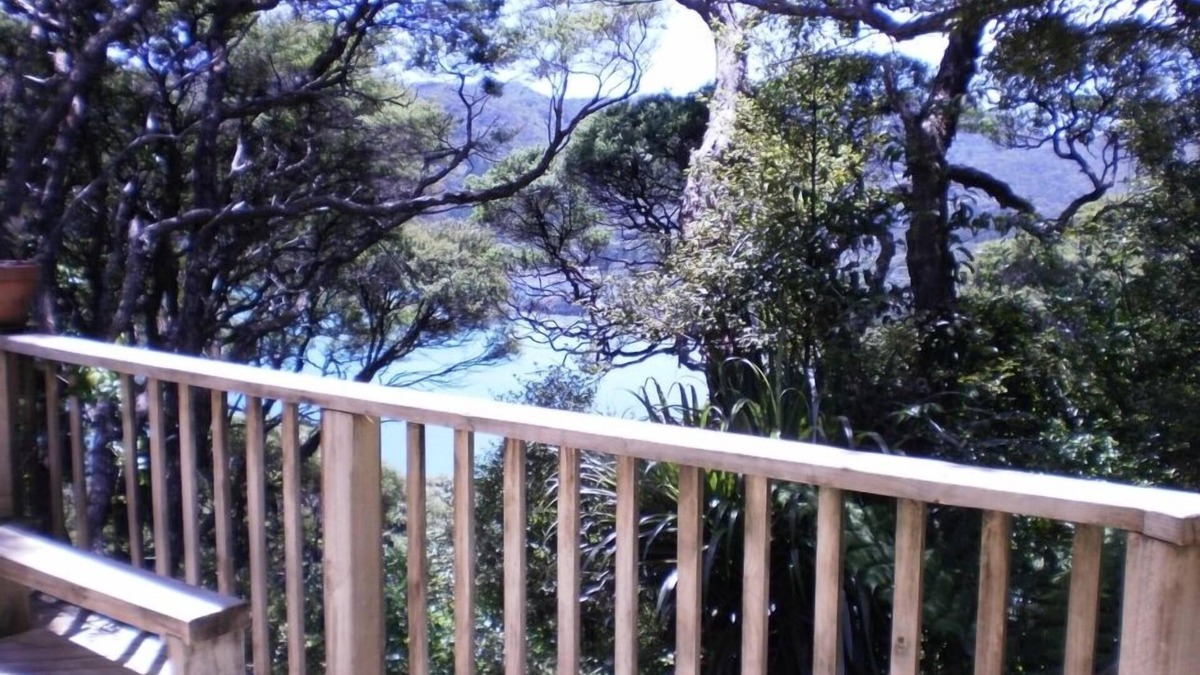 Tryphena House | Bach in quiet bush setting with sea views