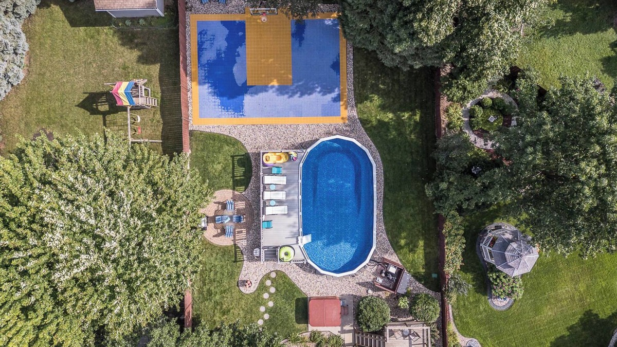 Sioux Falls House | Backyard Oasis- XL Pool, Hot tub, B-ball Court, Grill, Yard Games, Gaming Room!