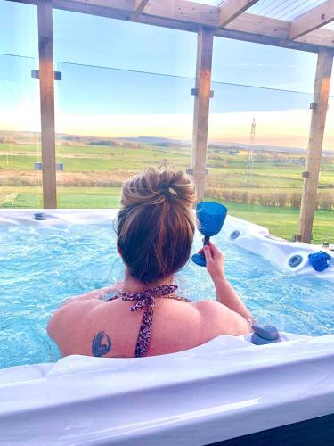 Cronberry House | Barlosh Barony Tpod Lodge Ayrshire, elec jacuzzi, BBQ, Firepit, Pizza Oven, indoor outdoor terrace with amazing views, spacious inside and out