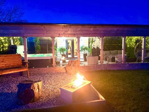 Cronberry House | Barlosh kiloch Tpod Lodge, Ayrshire, elec jacuzzi, bbq, Firepit, indooroutdoor terrace with outdoor sofa, egg chair,dinning country views,etc very spacious inside and out