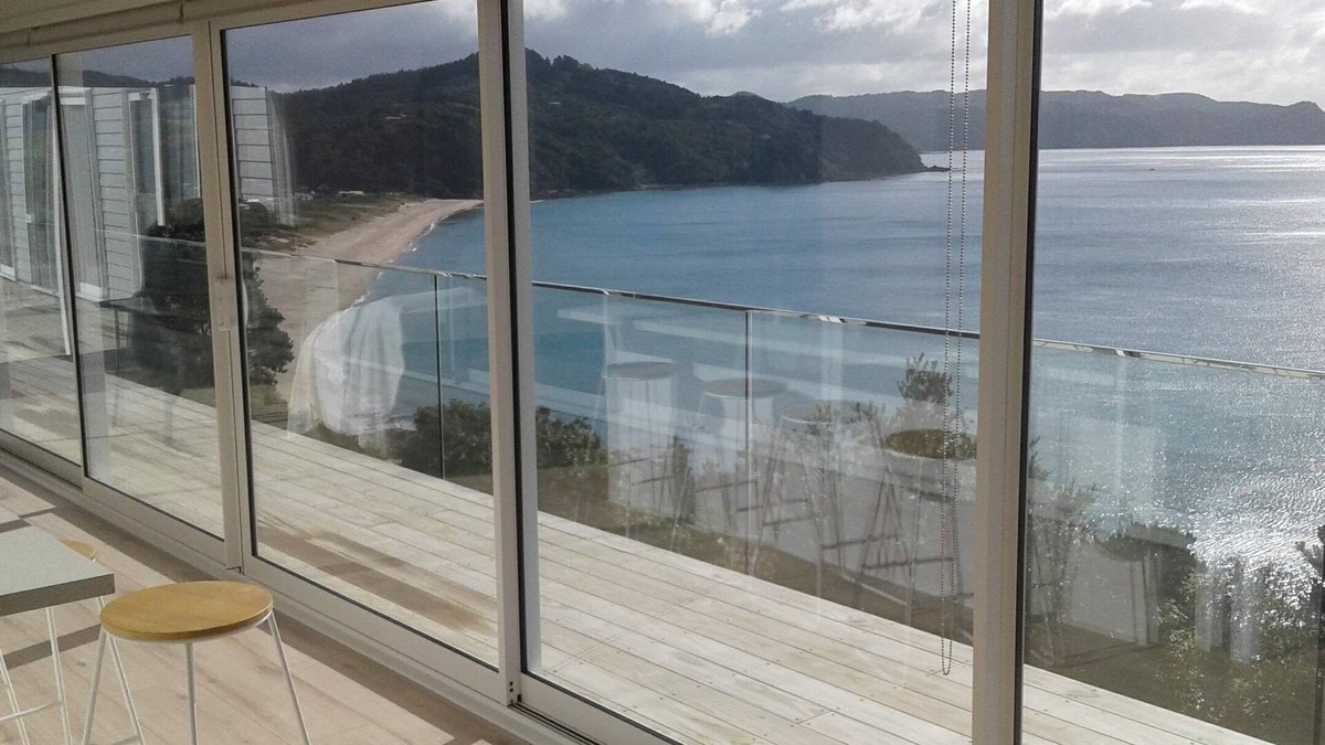 Tairua House | Beach and ocean views in every room.