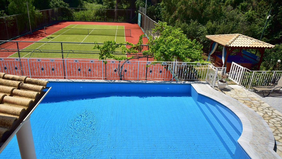 Roda Villa | Beachfront Family Luxury Villa Jolie: tennis, pool, jacuzzi, sauna, ping-pong.