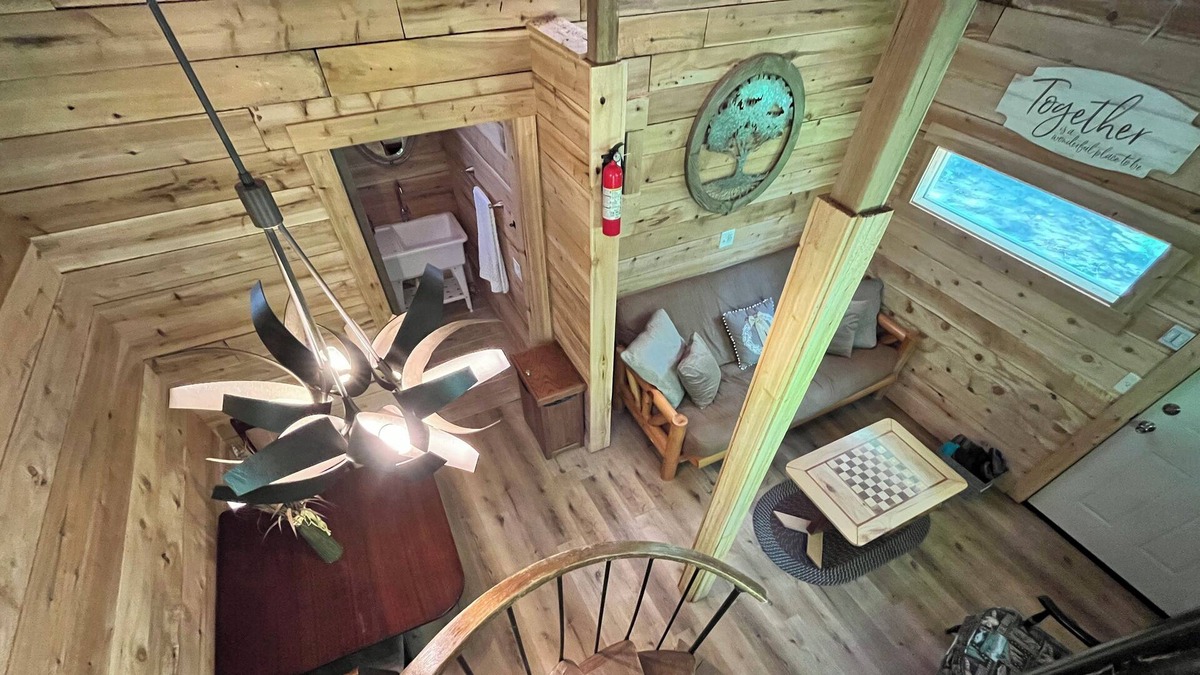 Kent County Cabin | Beautiful cedar treehouse that has wall-to-wall windows, forest and river view!