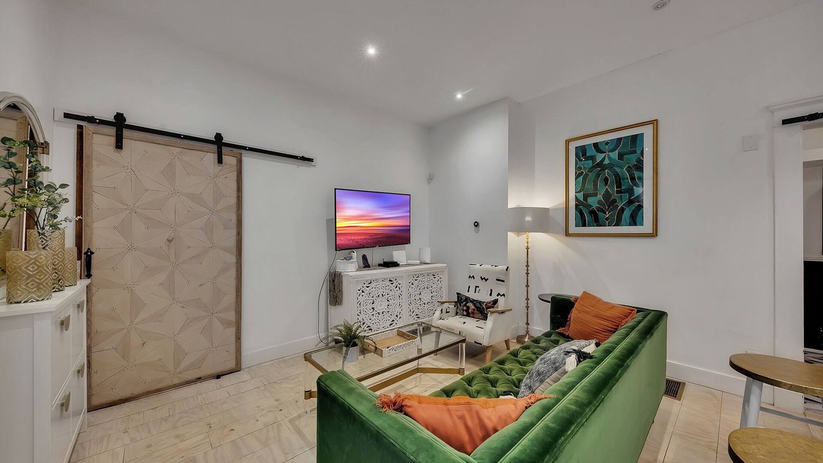 Midtown Apartment | Boho-style 2BR/2BA Midtown triplex with private front patio. King + queen bedrooms, updated kitchen, smart TVs, self check-in, and laundry. Walk to Piedmont Park, Trader Joe’s, and restaurants. Free street parking. No pets.