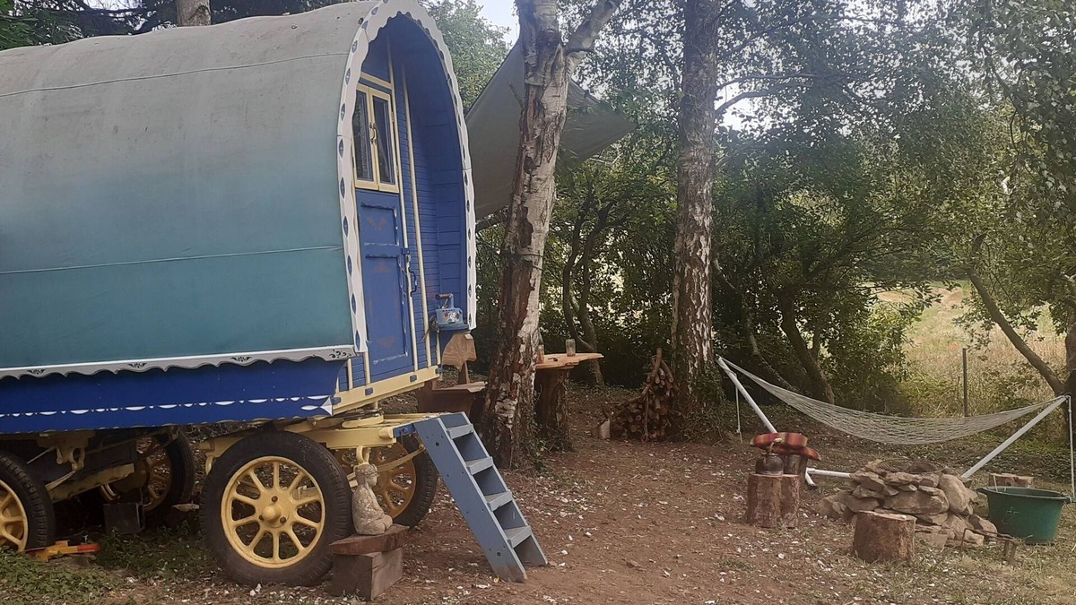 Belle-Isle-en-Terre House | Bow Top Wagon on forest edge
