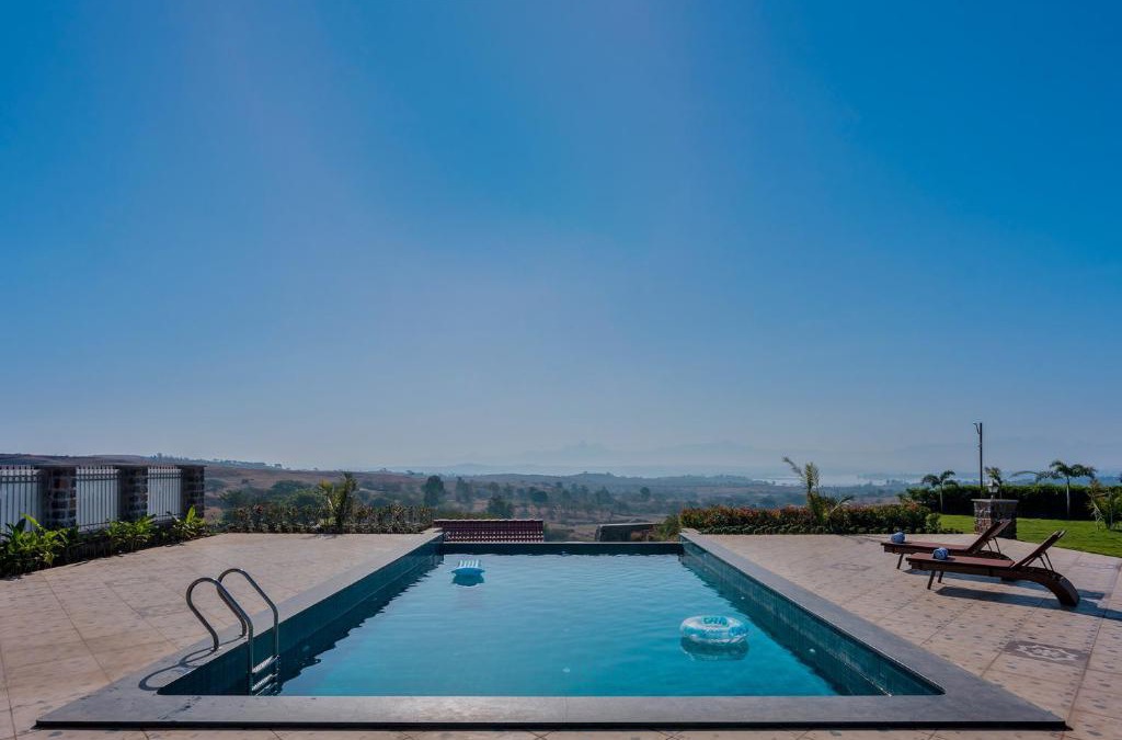 Igatpuri Villa | Breezy Whispers by StayVista - Private infinity pool, Stunning mountain views, Spacious swimming pool, Deck & Lawn
