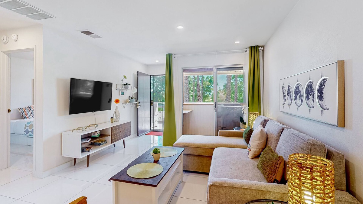 Racquet Club West Condo | Bright & modern dog-friendly oasis with pool, tennis courts, balcony, & A/C