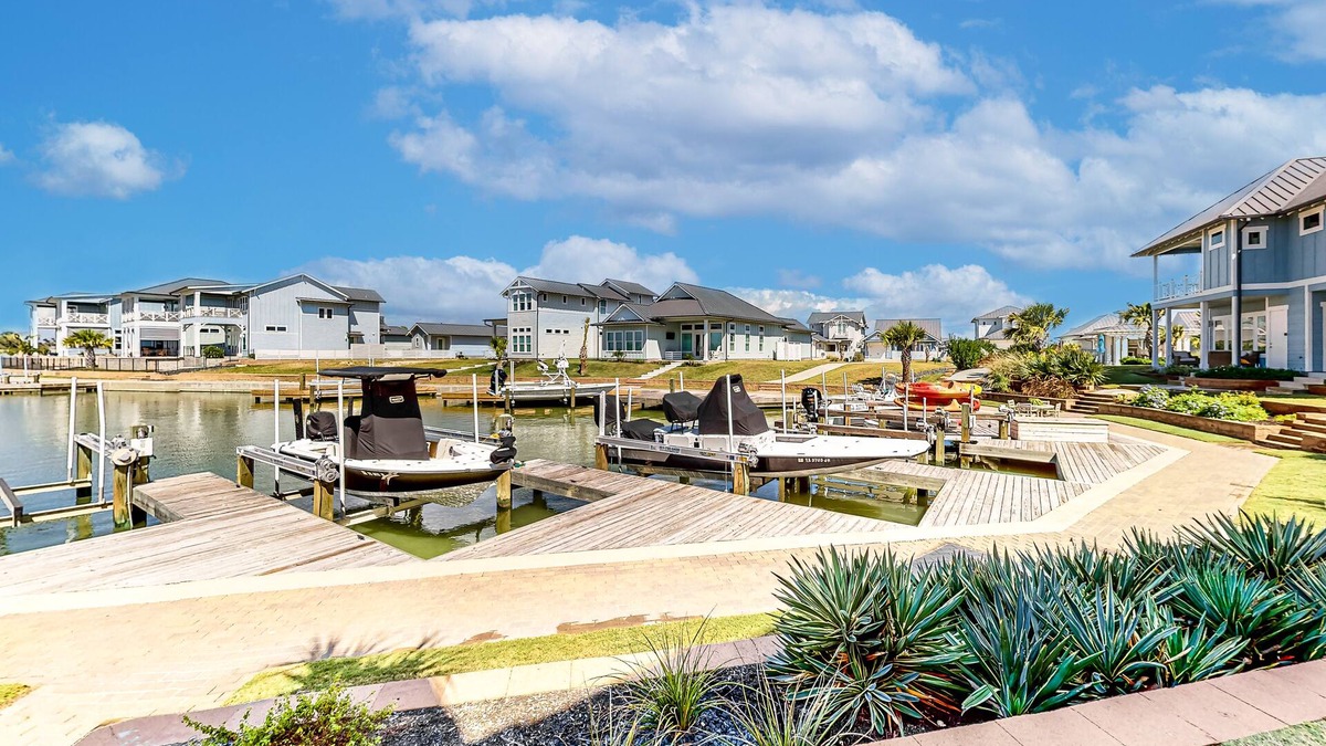 Rockport Villa | Bright waterfront villa with pool, boat slip, patio & balcony in gated community