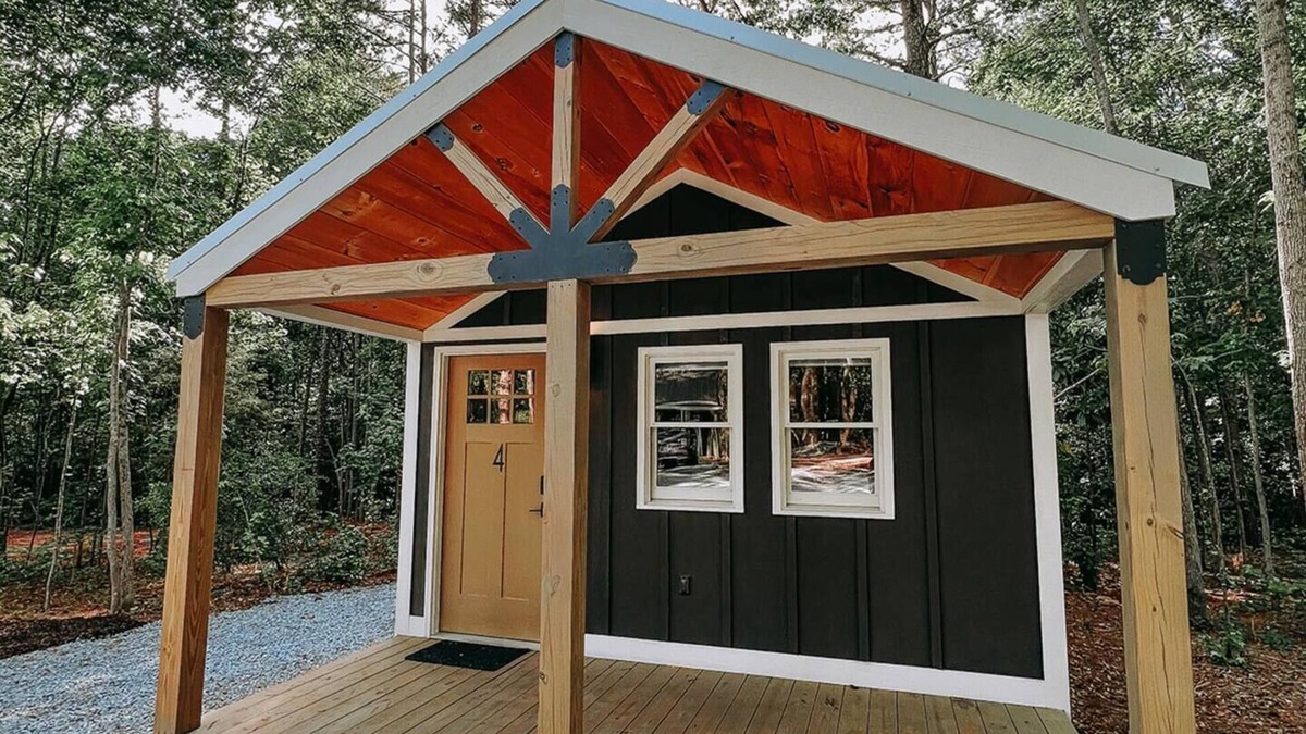 Hartwell RV Rental | Cabin #4: Two queen-size beds with a kitchenette and a large gravel parking pad beside the cabin for easy boat or trailer storage.