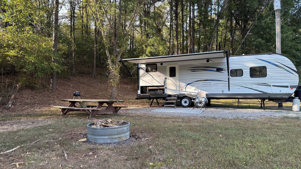 Jacob RV Rental | Camper in country setting beside water, near Burning Star Wildlife area