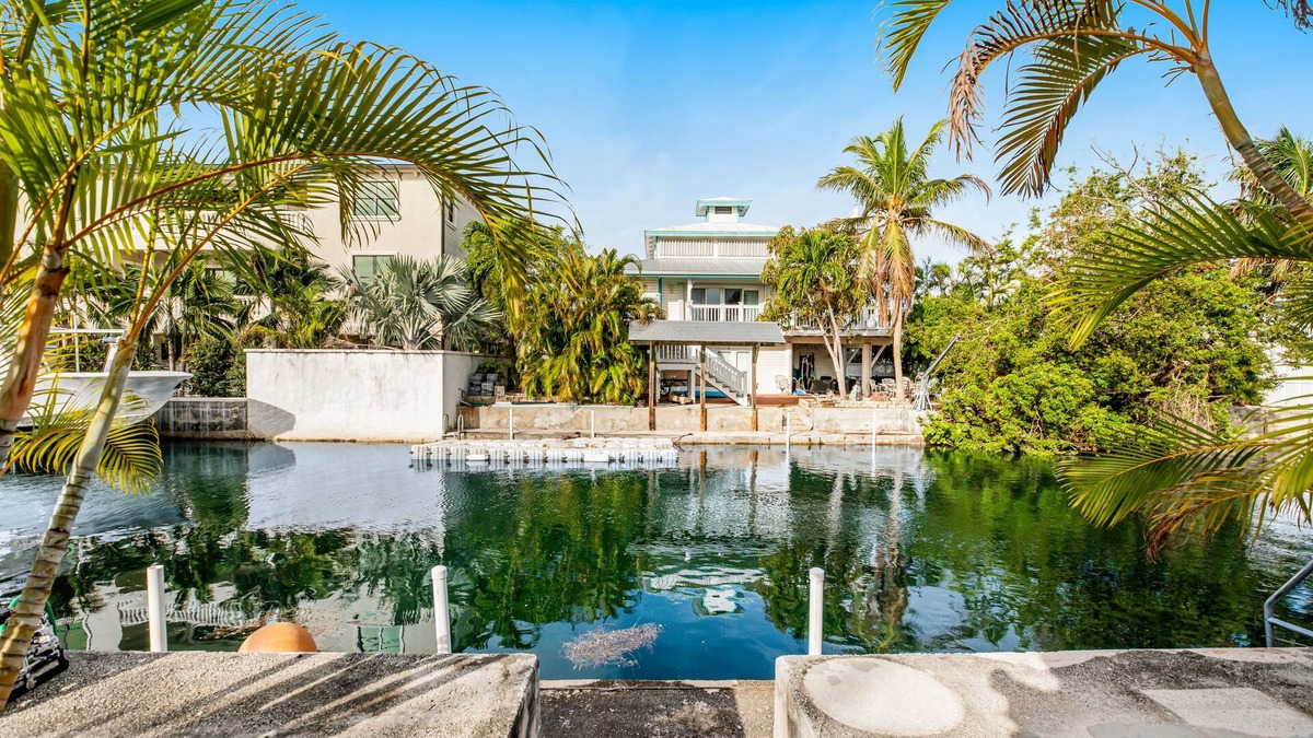 Big Coppitt Key House | Canalside condo with private dock, boat ramp, water-view patio, central AC & W/D