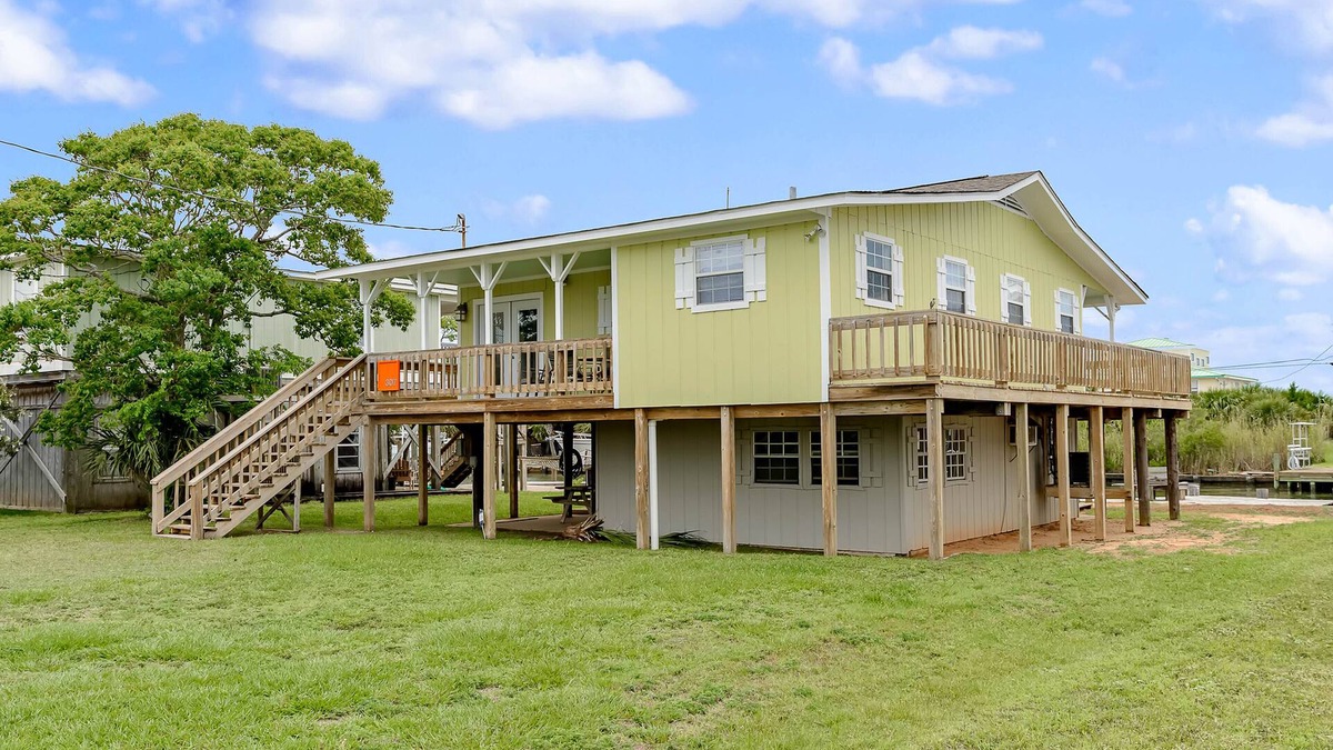 Royal Lagoons House | Canalside home with room for a boat - short walk from the beach
