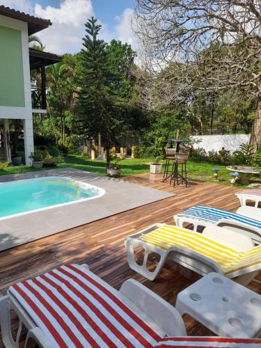 Caneca Fina House | Casa com piscina, espaço gourmet e salão de jogos.