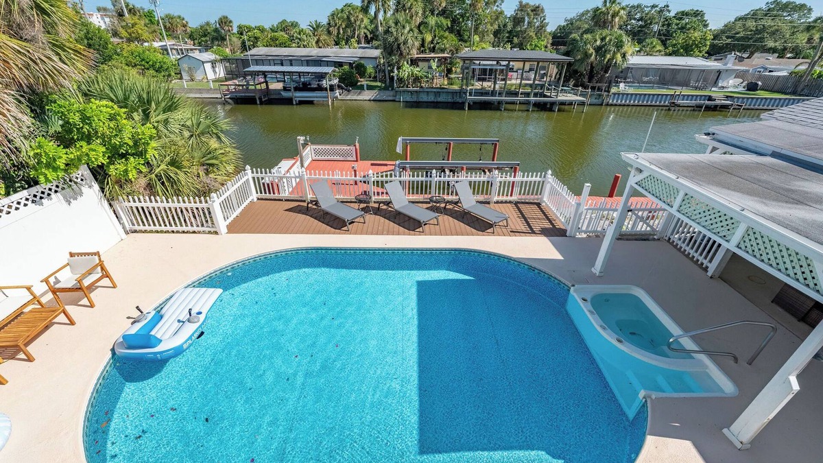 Hampton Homes House | Casa Las Olas - Waterfront Home with Heated Pool, Movie Theater & Arcade