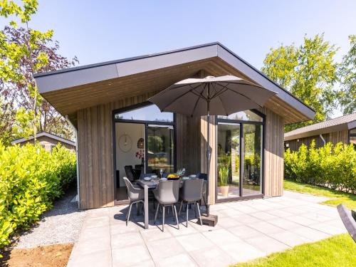 Municipality of Veldhoven Ski Chalet | Chalet by Pond with Sauna