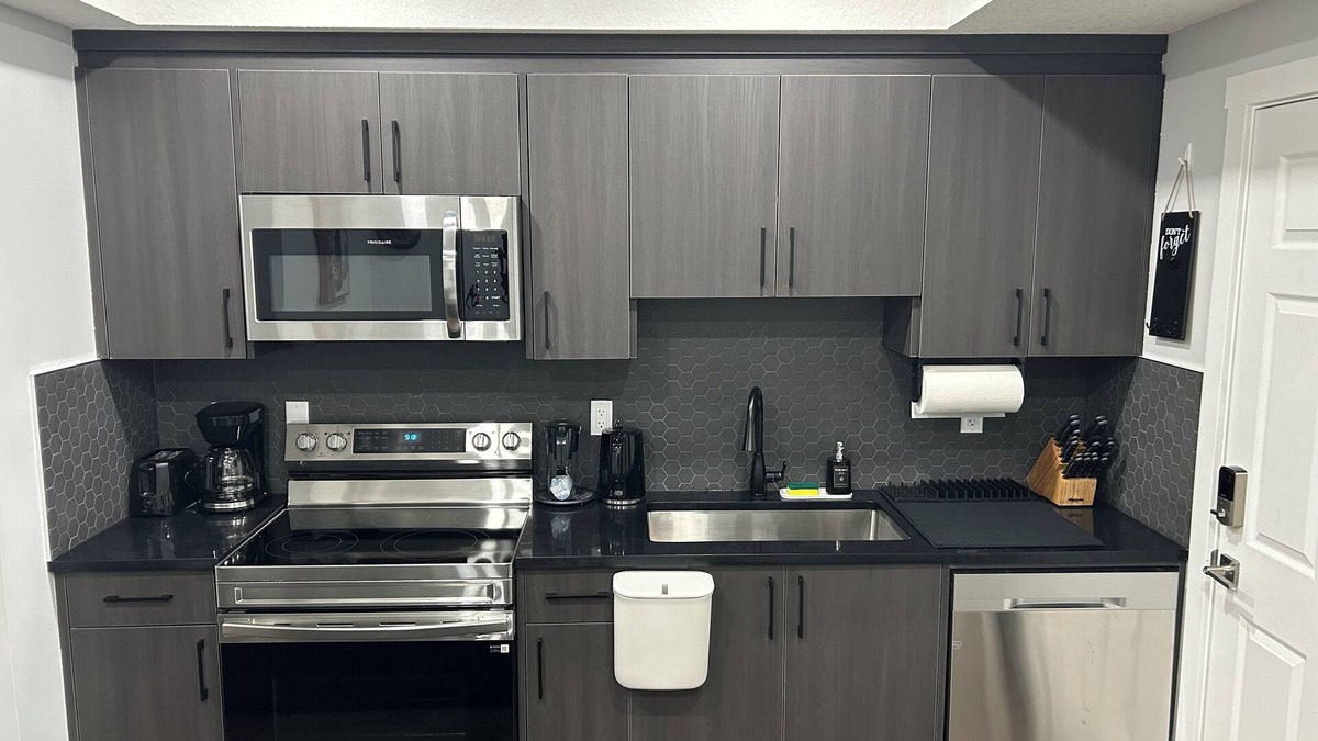 Calgary House | Charming 1-Bedroom Basement Walkout Suite with a Gym and Office.