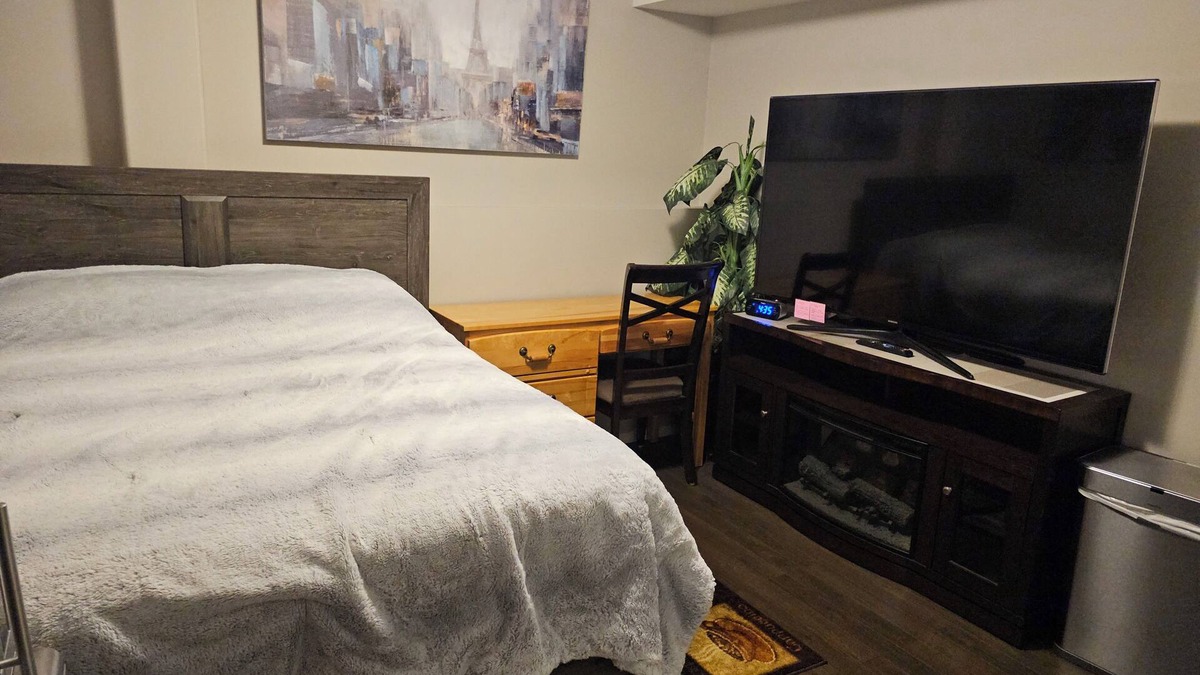 Red Deer House | Charming 1 bedroom rental in a family home in fabulous Red Deer-WiFi, AC & 65"TV