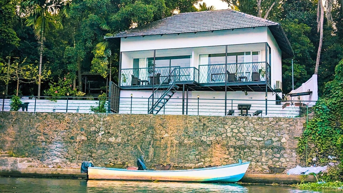 Aluva Cottage | Charming 2-bedroom cottage facing river with AC, WiFi in welcoming Aluva