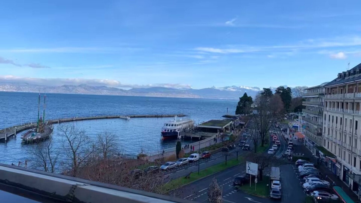 Evian-les-Bains Apartment | Charming little studio with lake and mountain views from the bed.