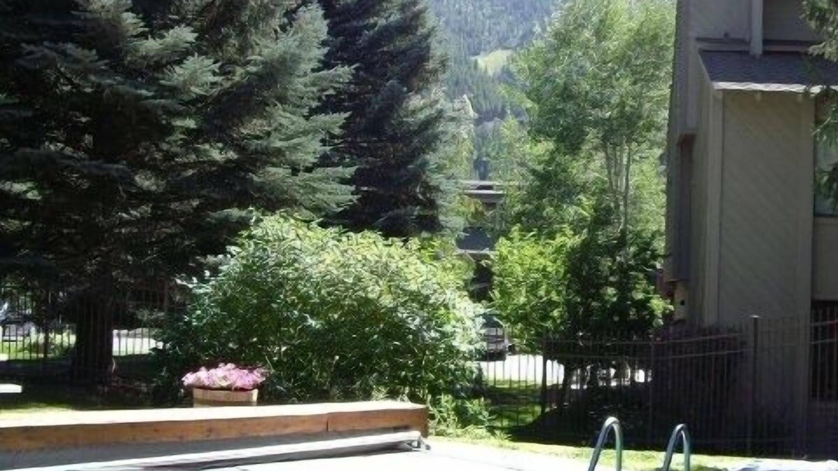 River Run Condo | Charming River Run condo with pool. Walk to ski mountain & town!
