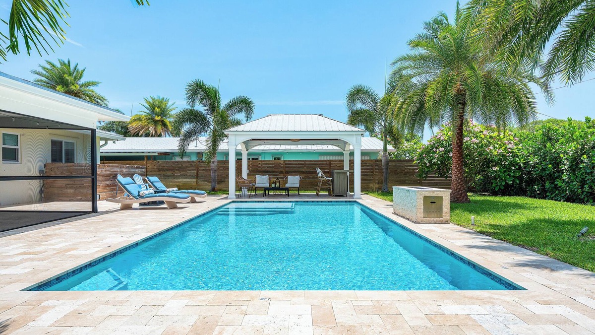 Hunt Club House | Clean Florida Coastal Design home with Heated Pool, Fireplace and Putt Putt