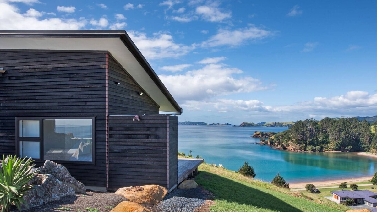 Kaeo House | Coastal Gem. Great sea views, decks for outdoor living and safe swimming beach.