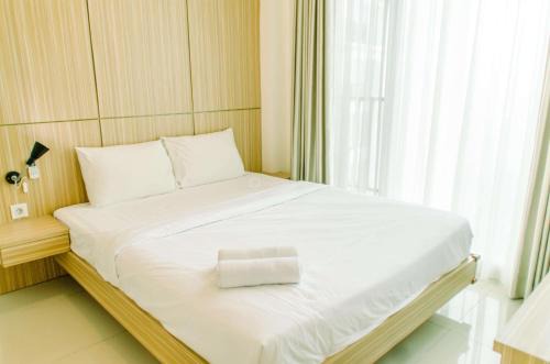 Serpong Apartment | Comfort and Minimalist 1BR at Tree Park City BSD Apartment By Travelio