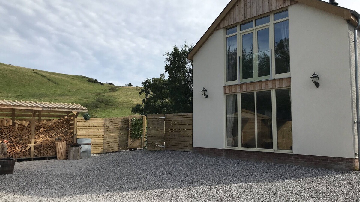 Graigfechan House | Countryside Home with jacuzzi hot tub, open plan living and wood burner.