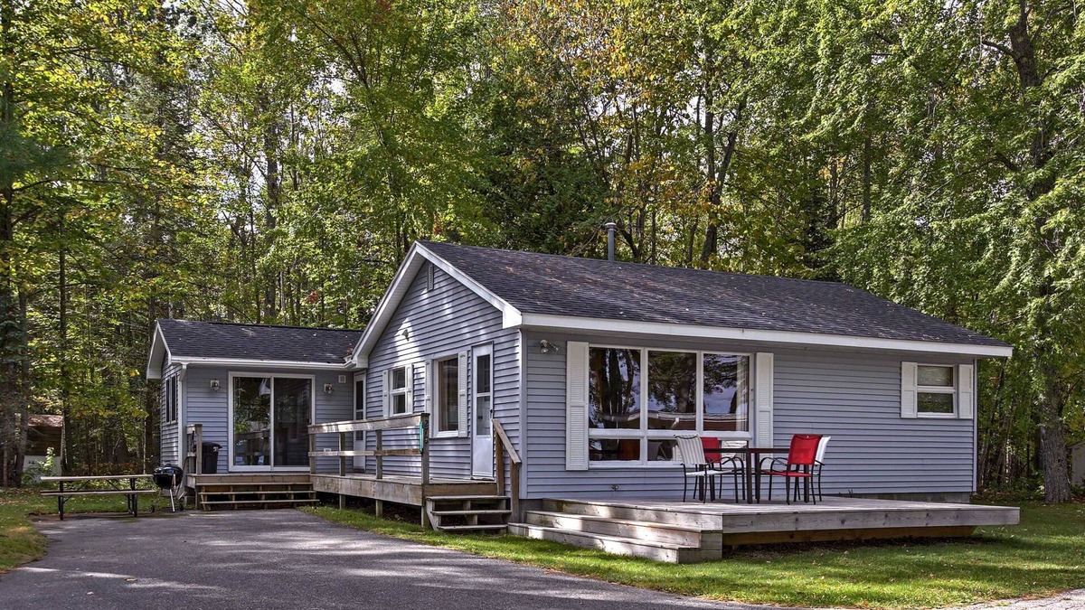 Burt Lake House | Cozy Alanson Cabin - steps to dock on Lake Burt!