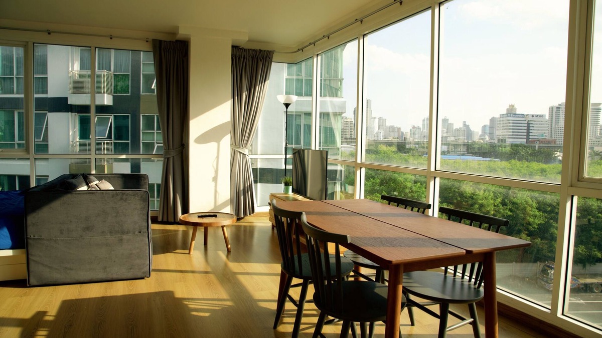 Rama 9 Apartment | Cozy and minimal big studio room with 2 sides of full glass wall