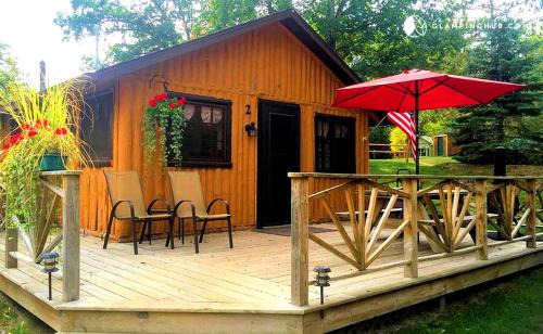 West Branch House | Cozy Cabin Rental with Stunning Lake Views in West Branch, Michigan