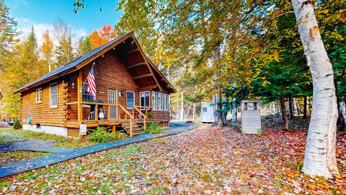 Beaver Cove House | Cozy cabin with covered porch, firepit, grill, fireplace, & washer/dryer