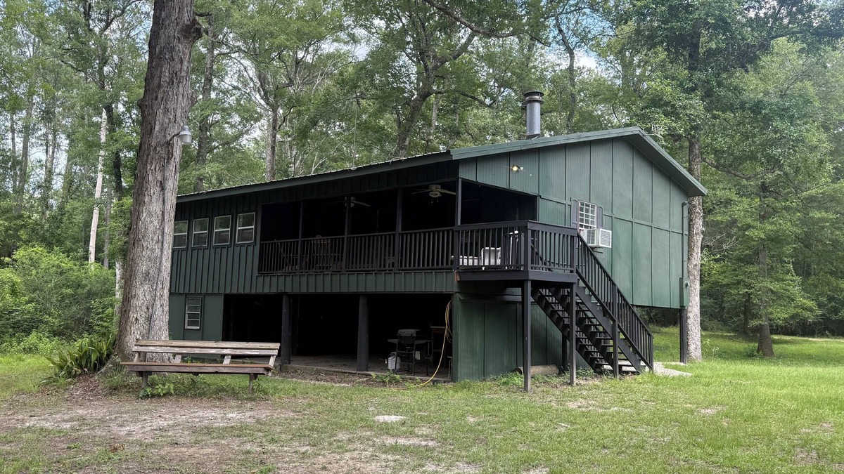 Fluker Cabin | Cozy Camp w/fire pit, grill and waterfront view of river. Pet Friendly!
