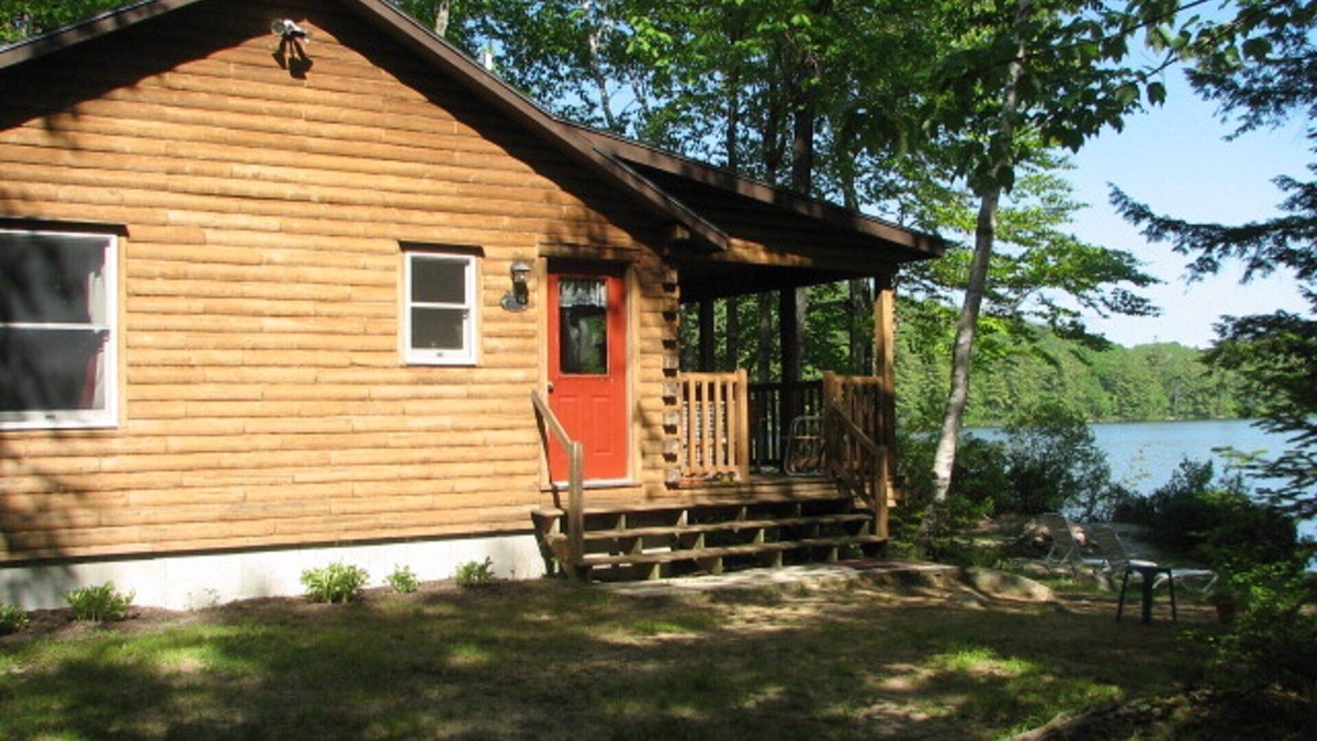 Norway Cabin | Cozy Cedar Log Cabin on Pristine Sand Pond in Norway, great for swimming.